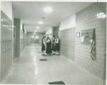 Sister and girls in hallway 150x120